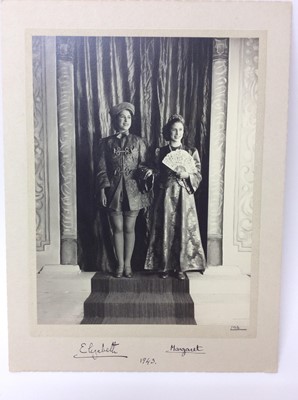 Lot 60 - T.R.H. Princess Elizabeth ( later H.M. Queen Elizabeth ) and Princess Margaret - fine and rare signed wartime portrait photograph of the two Royal sisters in their pantomime costumes for their prod...