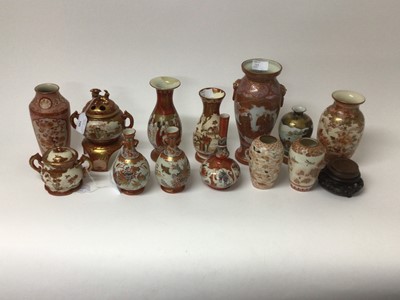 Lot 145 - Japanese ceramics, including a Kutani koro, twin-handled bowl and cover, and a collection of vases, the largest measuring 25cm height