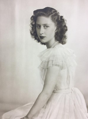Lot 68 - H.R.H. The Princess Margaret , fine late 1940s Dorothy Wilding black and white portrait photograph of the Princess in a ball gow,mounted on card and photographers stamp to imageand label verso 45.5...