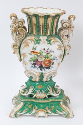 Lot 70 - Pair of 19th century French porcelain vases, of baluster form with scrollwork handles and base, painted with floral sprays on a green gilt ground, 26cm height