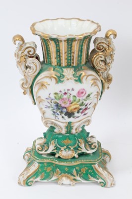 Lot 70 - Pair of 19th century French porcelain vases, of baluster form with scrollwork handles and base, painted with floral sprays on a green gilt ground, 26cm height