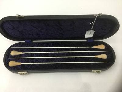 Lot 107 - Cased set of four conductor's batons