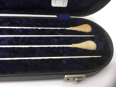 Lot 107 - Cased set of four conductor's batons
