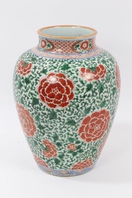 Lot 91 - 17th century Chinese Wucai porcelain baluster jar, decorated with peonies