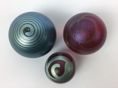 Lot 612 - Three Okra art glass paperweights by Richard Goulding (3)