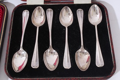 Lot 130 - Set of six Edwardian silver Old English pattern teaspoons, with matching sugar tongs in a fitted case, (Sheffield 1908) together with a set of six George V silver coffee spoons in a fitted case, (S...