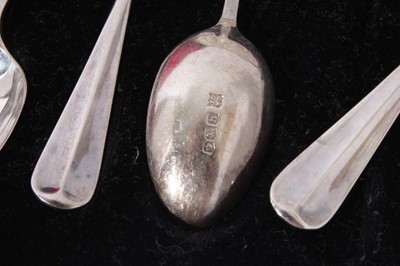 Lot 130 - Set of six Edwardian silver Old English pattern teaspoons, with matching sugar tongs in a fitted case, (Sheffield 1908) together with a set of six George V silver coffee spoons in a fitted case, (S...