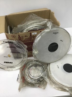 Lot 70 - Box of approximately 30 drum heads by Premier, Remo and others, the largest (snare) approximately 36cm diameter, all in original packaging and mostly original condition but some age related stainin...