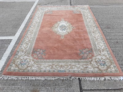 Lot 1067 - Chinese rug with floral decoration, 281cm x 182cm