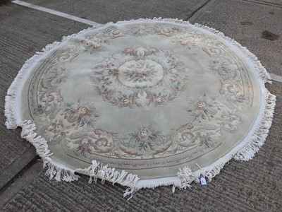 Lot 1069 - Large circular Chinese rug with floral decoration, 239cm diameter