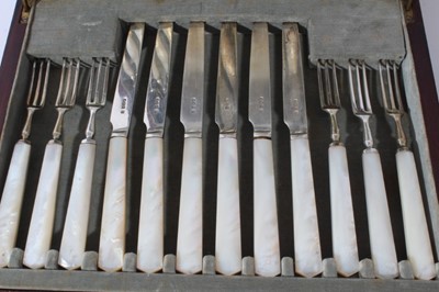 Lot 152 - George V silver dessert cutlery comprising twelve knives and twelve forks, (Sheffield 1929) maker, Cooper Brothers, together with one other set, in a fitted velvet lined mahogany box
