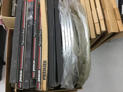 Lot 121 - Large quantity of drum heads, including six Premier bass drum skins, various others, the majority in time-stained and damp wearied boxes but the contents apparently ok