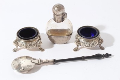 Lot 167 - Pair of Victorian silver salts of cauldron form with embossed decoration, beaded border and blue glass liners, raised on three pad feet, (London 1866) together with a Victorian silver mounted glass...