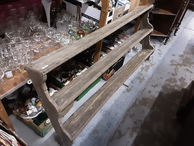 Lot 1077 - Pine plate rack, 157cm wide, 72cm high, a nest of three tables and an oak dresser back