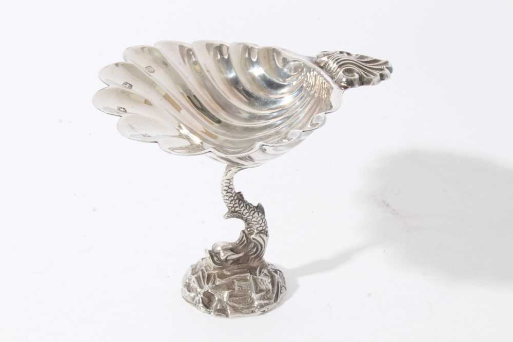 Lot 184 - Good quality contemporary silver dish in the form of a scallop shell, with shell thumb piece, raised on classical Dolphin, on naturalistic base, (Sheffield 1973), maker Royal Irish Silver Co, all a...