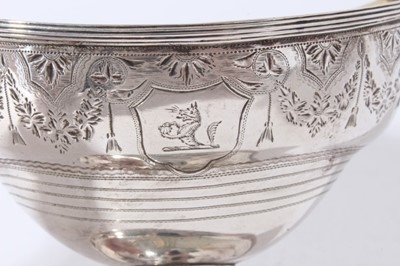 Lot 185 - George III silver sugar basket of navette form with brite cut engraved decoration, engraved armorial, swing handle with gilded interior, raised on oval pedestal foot, (London 1794), maker H S, all...