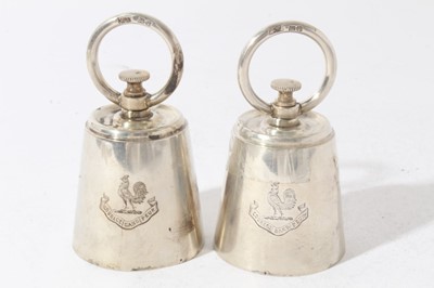 Lot 187 - Pair of unusual Edwardian novelty pepper grinders in the form of 2lb Bell weights, with engraved armorials and circular paniels marked 'lbs 2', (London 1902), maker Mappin & Webb, each 10.5cm in he...