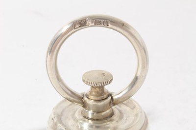 Lot 187 - Pair of unusual Edwardian novelty pepper grinders in the form of 2lb Bell weights, with engraved armorials and circular paniels marked 'lbs 2', (London 1902), maker Mappin & Webb, each 10.5cm in he...