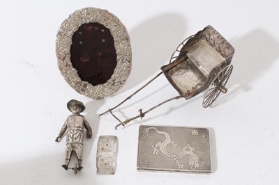 Lot 190 - Late 19th century Chinese Export silver model of a Rickshaw with marks to base for Wing Nam & Co and character marks, together with a silver oval photograph frame stamped Sterling and a silver ciga...