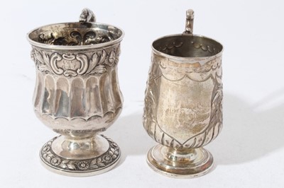 Lot 194 - George IV silver christening mug of baluster form with embossed decoration, intertwined serpent scroll handle, on circular foot, (London 1825) together with a Victorian silver christening mug with...
