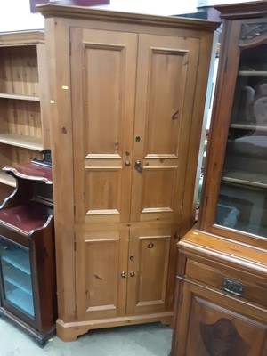 Lot 1084 - Pine corner cupboard with shelved interior enclosed by four panelled doors, 99cm wide, 201cm high