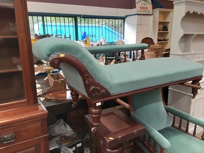 Lot 1085 - Victorian mahogany framed chaise longue with blue upholstery on turned legs and castors, 190cm