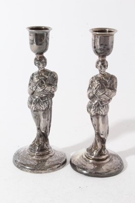 Lot 201 - Pair of unusual Victorian silver figural candlesticks modelled as William Shakespeare, with inverted bell shaped candle holders, on circular bases with engraved armorials, (London 1888), maker Chil...
