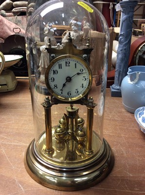 Lot 444 - Brass anniversary clock under glass dome