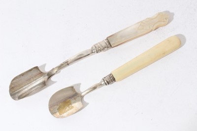 Lot 204 - Victorian silver Stilton scoope of conventional form with carved mother of pearl handle (Birmingham 1850) together with another George III example with Ivory handle, (Birmingham 1809),  20.5 and 16...