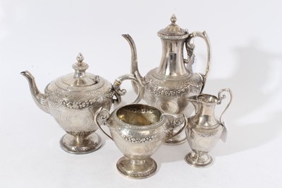 Lot 210 - Good quality Victorian silver tea and coffee set comprising teapot of ovoid form, with engraved and chased decoration, domed hinged cover, silver loop handle with ivory insulators, on circular pede...