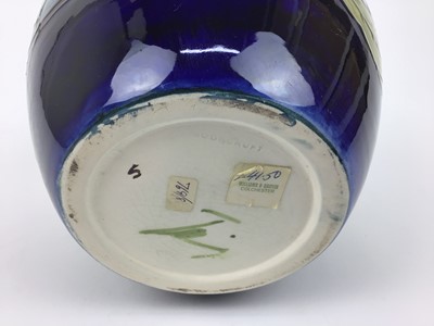 Lot 67 - Moorcroft pottery ginger jar and cover decorated in the Magnolia pattern on blue ground, impressed marks and green painted signature to base, 20.5cm high