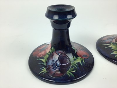 Lot 72 - Pair of Moorcroft pottery candlesticks decorated in the Anemone pattern, impressed marks and original paper labels to both bases - Potters To The Late Queen Mary, 11cm high
