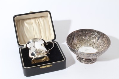 Lot 218 - Edwardian Art Nouveau silver bowl of circular form with embossed floral decoration, on pedestal foot, (Sheffield 1901), maker James Dixon & Sons, together with a silver christening mug (Birmingham...