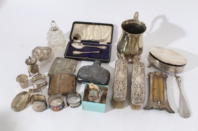 Lot 219 - George V silver cigarette case with engine turned decoration, (Birmingham 1911) together with a group of silver and silver plated items to include napkin rings, brushes and vanity jars, approximate...