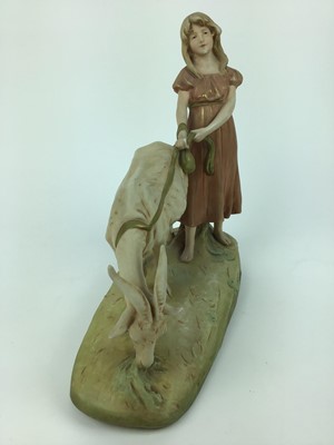 Lot 79 - Royal Dux porcelain model of a girl with a goat, pink triangle mark to base, 29cm wide, 30cm high