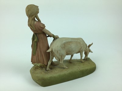 Lot 79 - Royal Dux porcelain model of a girl with a goat, pink triangle mark to base, 29cm wide, 30cm high