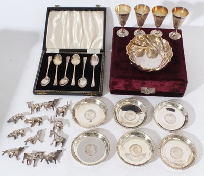 Lot 224 - Set of six George V silver coffee spoons (Birmingham 1922), maker William Suckling Ltd, in a fitted case, together with a silver (800) dish, six white metal coasters set with Indian quarter Anna co...