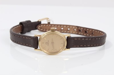 Lot 135 - Lady's Omega 9ct gold oval wristwatch on brown leather strap