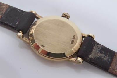 Lot 135 - Lady's Omega 9ct gold oval wristwatch on brown leather strap