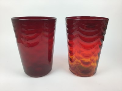 Lot 85 - Two large Whitefriars Ruby red waved ribbed vases, 29cm high