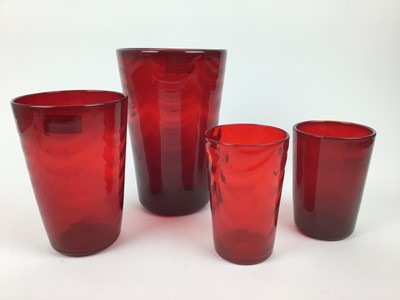 Lot 87 - Four Whitefriars Ruby red wave ribbed vases, 25cm, 20cm, 15.5cm and 15.5cm