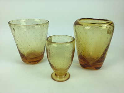 Lot 91 - Three Whitefriars Amber controlled bubble vases including one with original Whitefriars label, 18cm, 19cm and 14.5cm