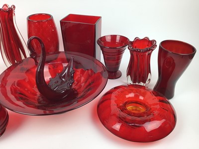 Lot 92 - Twelve pieces of Whitefriars Ruby red glass including large bowl, 31cm diameter,  controlled bubble vase, 20.5cm high, wave bowl, 17cm diameter and ribbon trailed vase, 14cm high