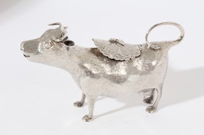 Lot 241 - George III silver cow creamer, naturalistically modelled, the horned cow with open mouth, textured detail to body, central hinged cover, standing on all fours, (London 1765), maker probably John Sc...