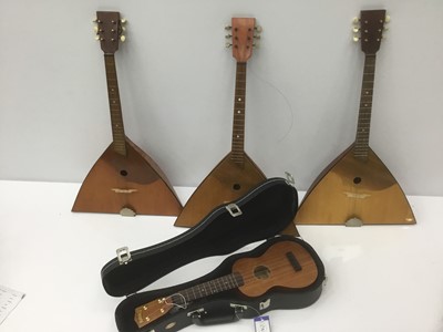 Lot 211 - Cased ukulele and three other stringed instruments