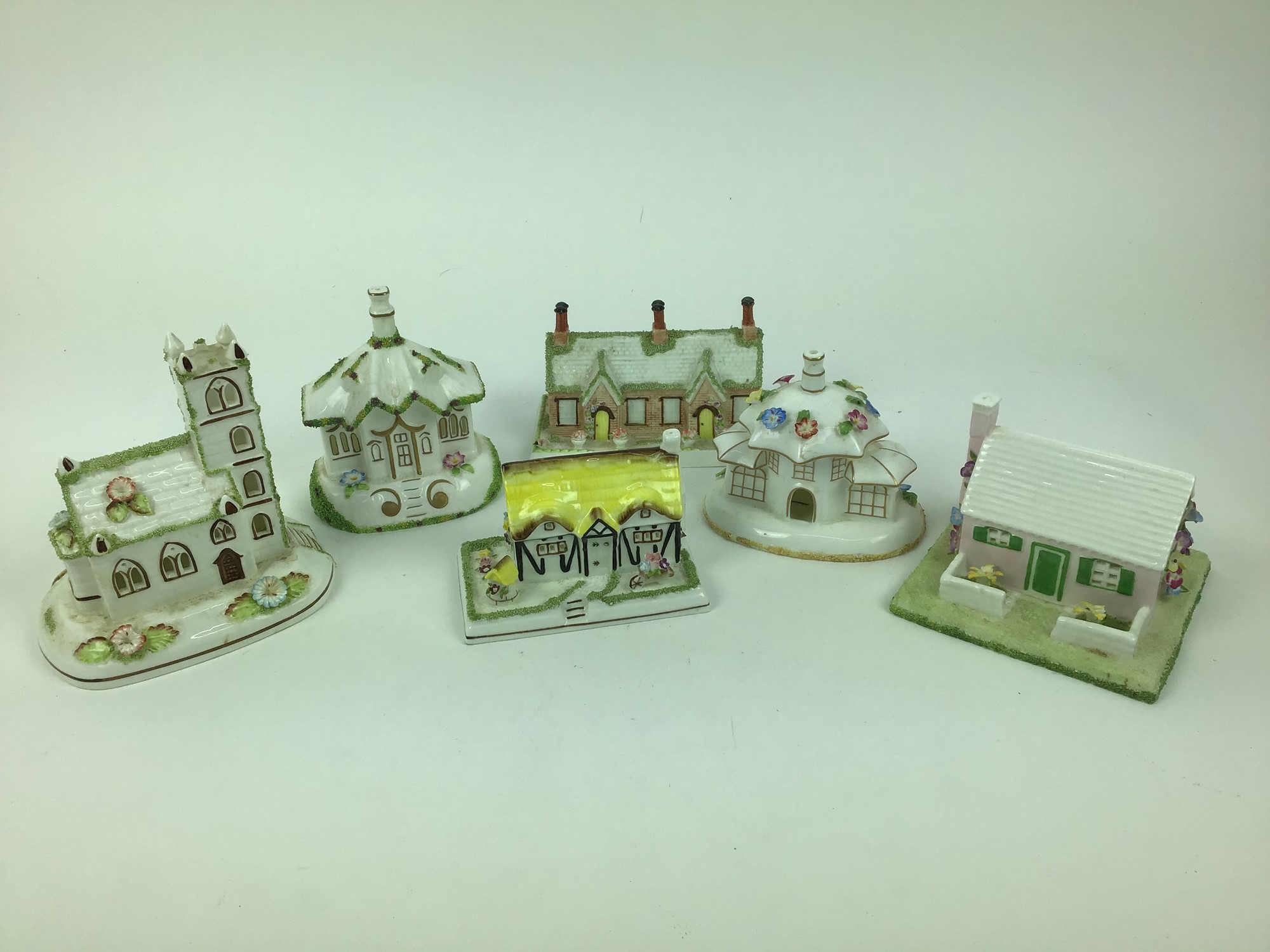 Lot 125 - Collection of twelve Coalport cottages