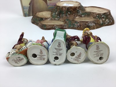 Lot 149 - Five Royal Doulton Bunnykins figures - Mr Bunnykins, Buntie, Rise and Shine, Sleigh Ride and Tally Ho, Beswick stand and a book - A History Of The Writings of Beatrix Potter