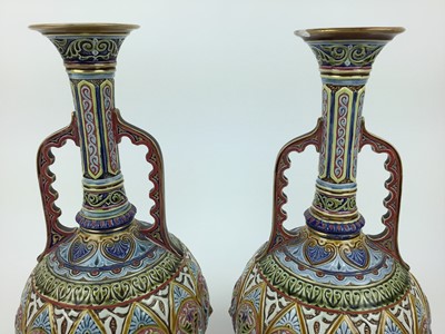 Lot 194 - Pair of 20th century twin handled vases, possibly by zsolnay pec impressed marks to base number 1202, 38cm high