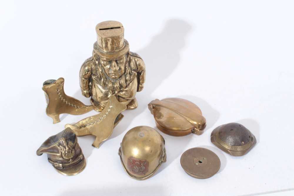 Lot 270 - Early 20th century brass 'Transvaal money box' together with brass models of military helmets and other brass ware including Trench Art