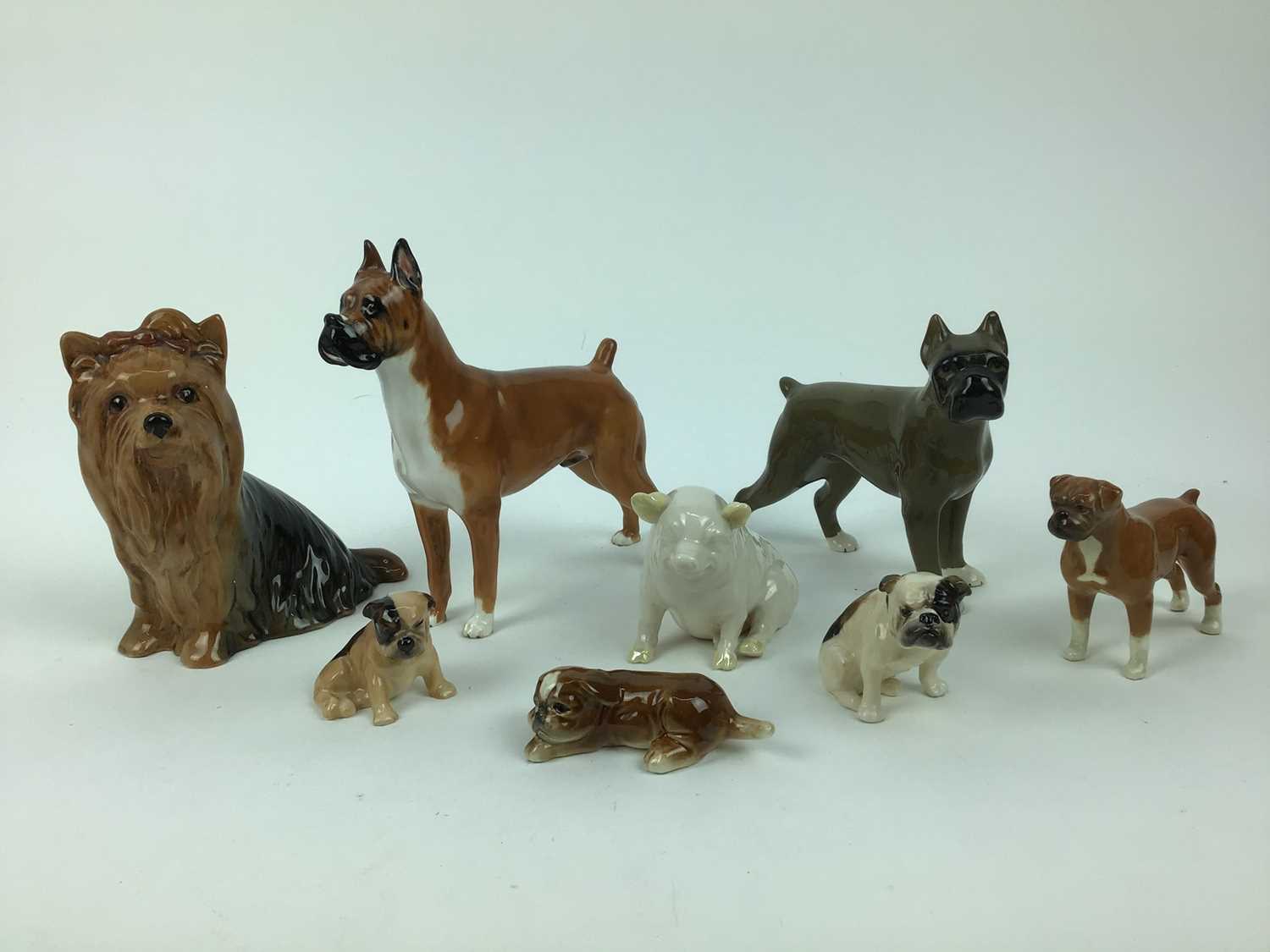 Lot 206 - Belleek model of a pig and seven various dog ornaments including Royal Doulton and Beswick